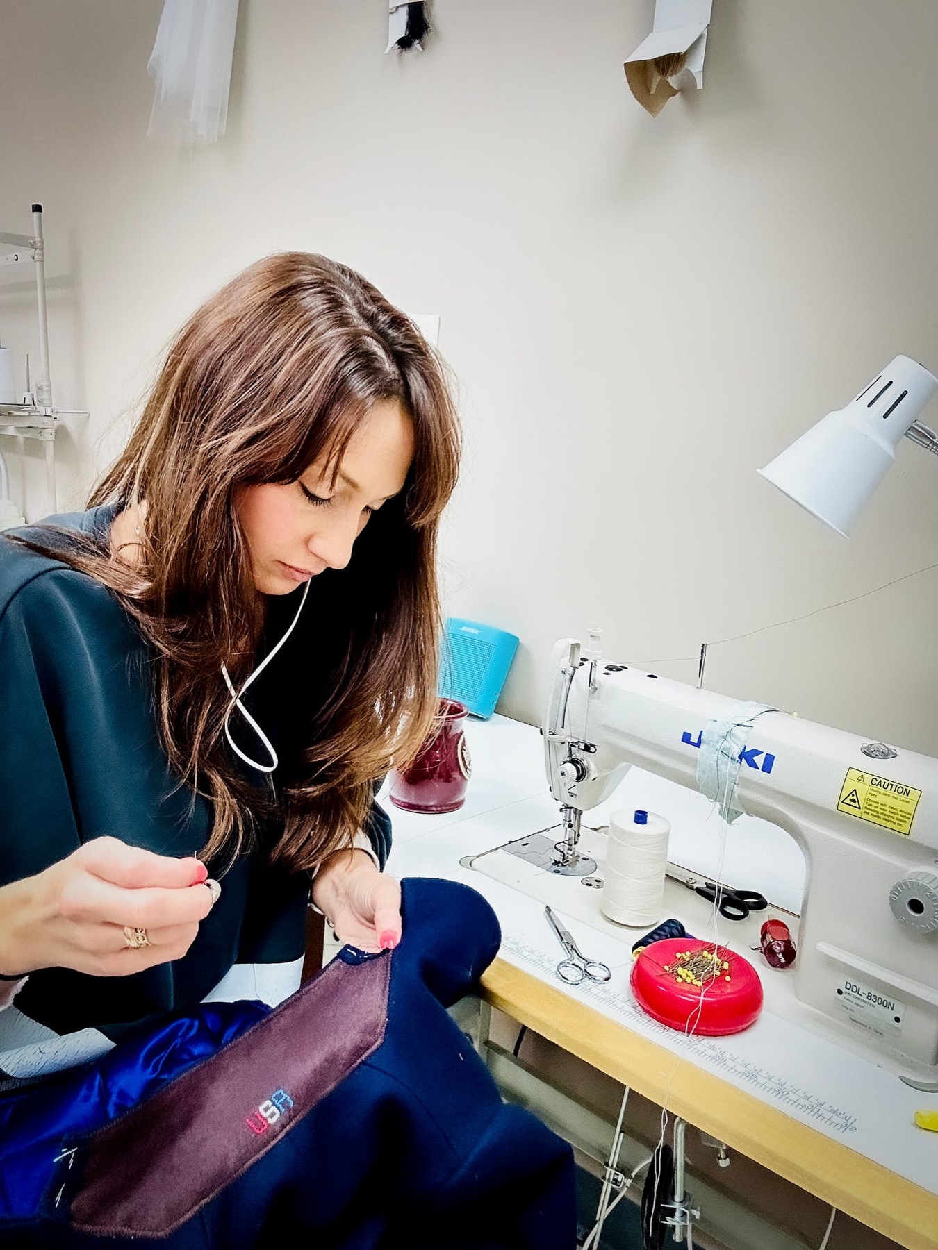 Mary Grace Godfrey sewing one of the Vance boys' Inauguration coats